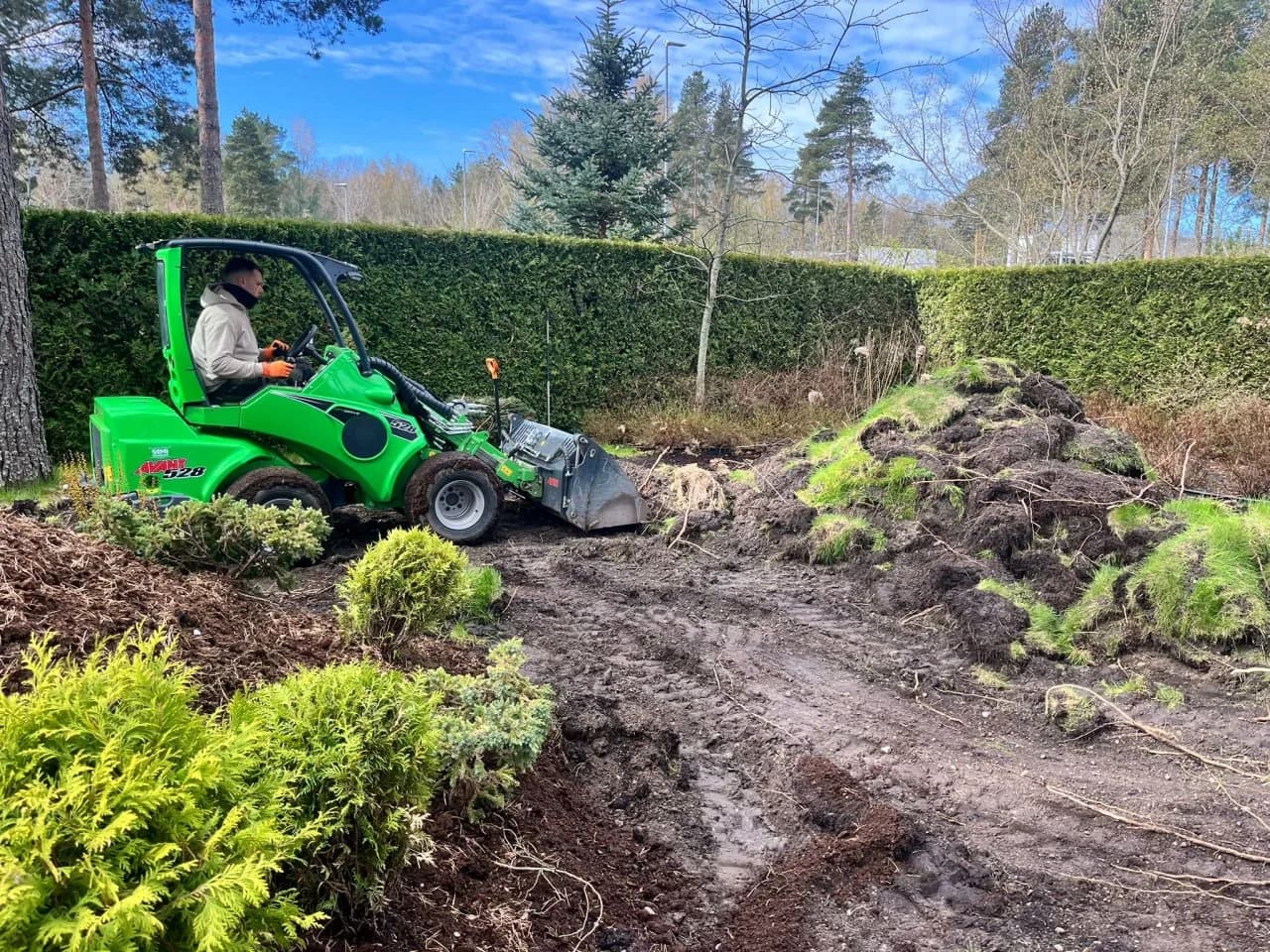 Compact loader removing old turf
